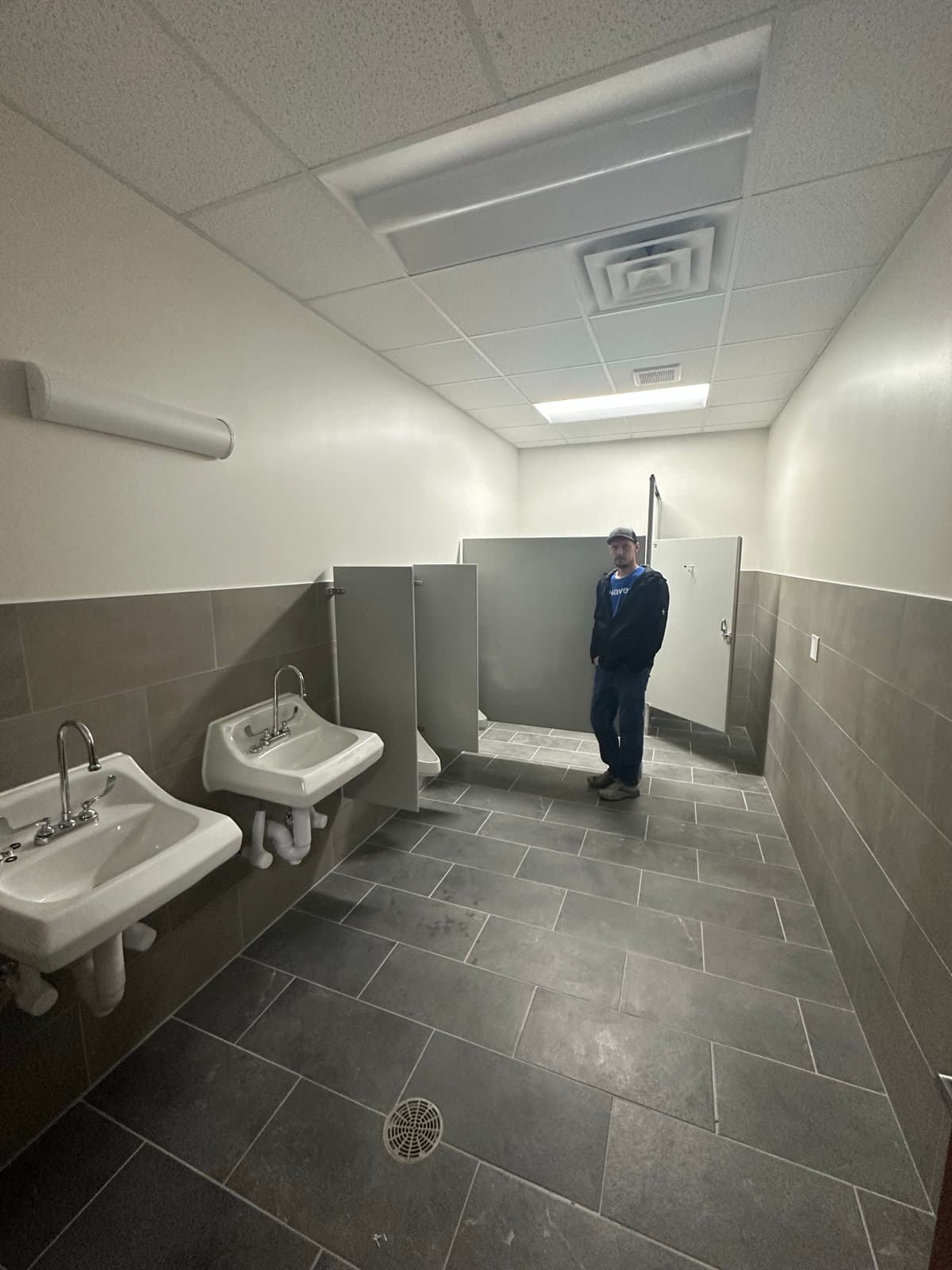 Multi-stall commercial restroom with wall-mount sinks — Indiana Flow Indianapolis
