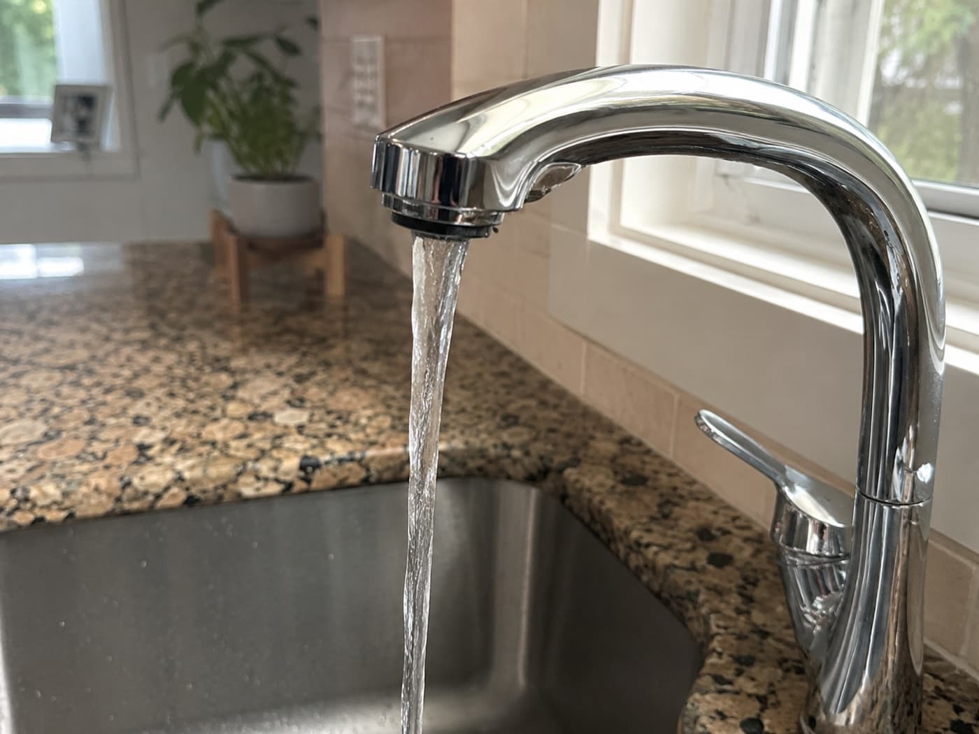 Clear water running from a kitchen faucet after a plumbing service visit in Westfield, Indiana — Indiana Flow